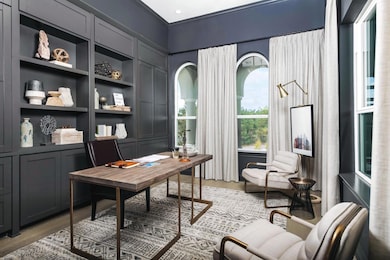 Office space with light wood-style flooring and b