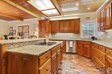 Slab granite, cypress cabinets