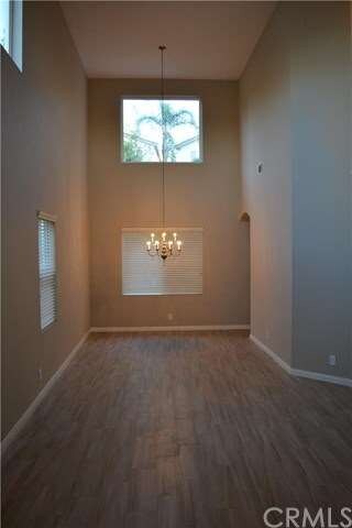 View from entry-volume ceilings in living and dini