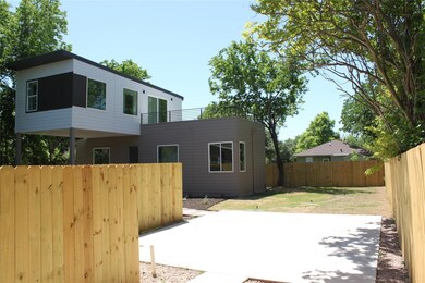 Rear view of house featuring a patio and a balcony