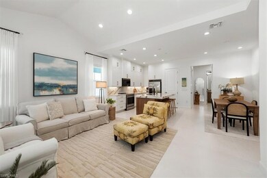 Living room with recessed lighting and vaulted cei