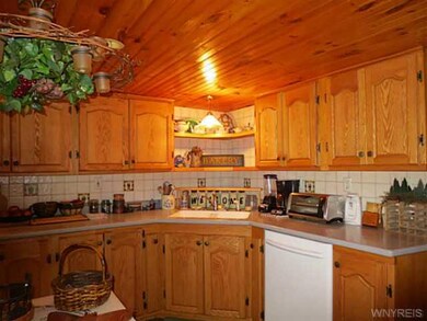Exterior Front. Custom kitchen cabinets.