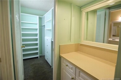 Primary bedroom walk-in closet with counter area