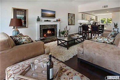 Beautiful marble wood burning fireplace in living 