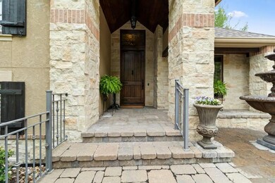 A knotty alder-planked front door brings warm, wel