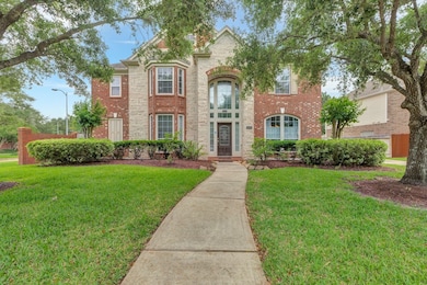 Charming two-story brick home with a well-manicure