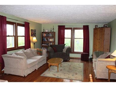 Family Room. The family room is open to the kitchen which makes entertaining easy.  Notice all of the windows.