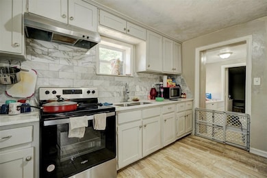 Kitchen with appliances with stainless steel finis
