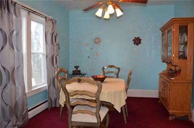 Formal dining room offers ceiling fan & rosette tr