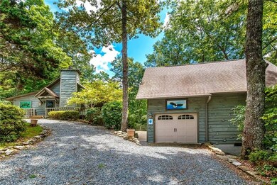 Separate 1 car garage with workshop and large art 