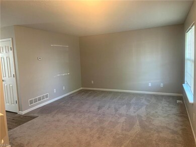 Freshly painted and newly carpeted living room.