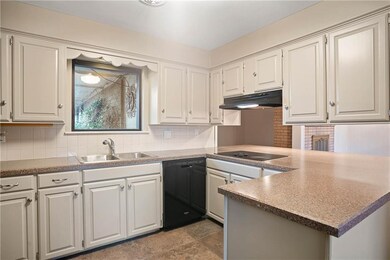 The kitchen cabinets have been updated with a mode