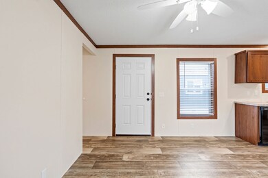 Interior entry view featuring Cafe Au Lait vinyl flooring and Caramel trim