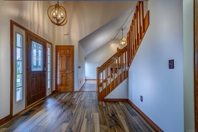 View of Foyer and stairway looking in to the Great