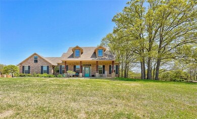 Curb Appeal! Long, wide front porch, mature oak tr