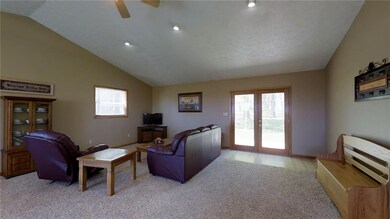Double doors let in natural light from your back yard - which just happens to be just under 4 acres.