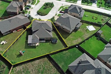 This birds-eye perspective showcases the completely fenced private Backyard. Notice the large back porch and pergola, perfect for entertaining guests outdoors.