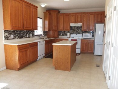 Open kitchen with center island, pantry and large 