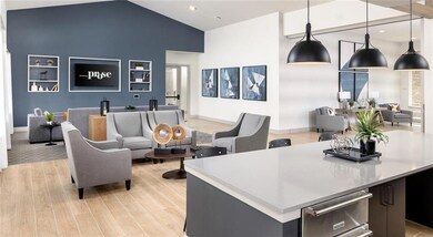 Community lobby with recessed lighting and high vaulted ceiling