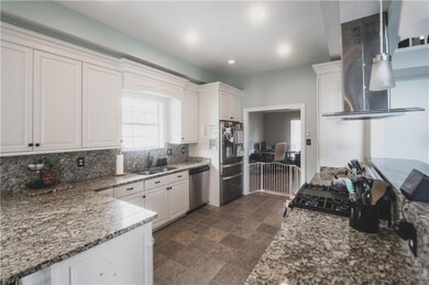 Kitchen with granite coutertops and stainless stee