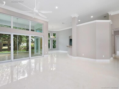 Living area aglow with natural light..  Sliding im