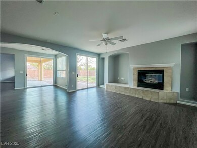 Unfurnished living room with dark wood-style floor