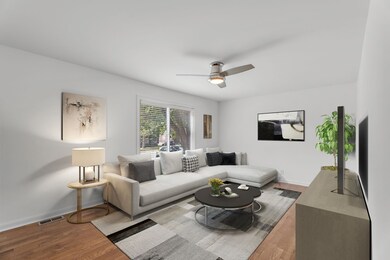 Immediately upon entry, the Den welcomes you!   * Room is virtually staged *