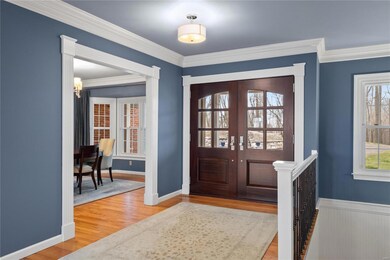 Spacious entry foyer features hard wood flooring, 