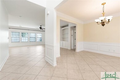 2 story foyer opens into dining room and family ro