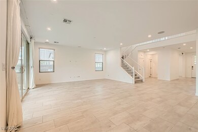 Family room featuring stairway, recessed lighting