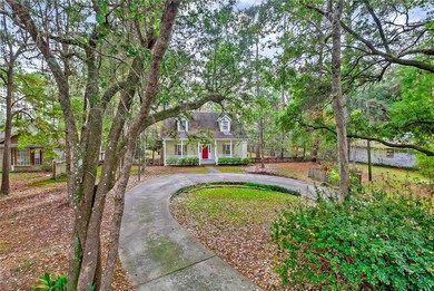The concrete circular driveway provides ample spac
