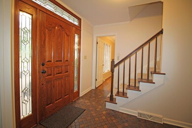 Wood door with leaded glass sidelites