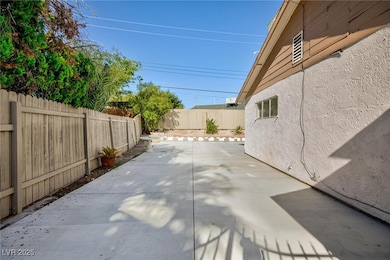 Fenced backyard featuring a patio