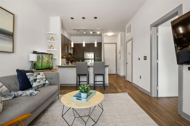Living room with dark wood-type flooring