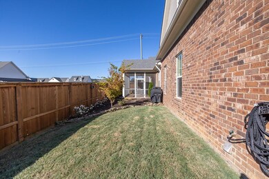 View of yard featuring a sunroom