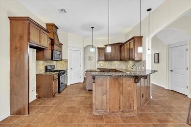 Kitchen with appliances with stainless steel finis