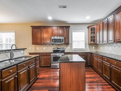 Granite countertop. 42in cabinets.