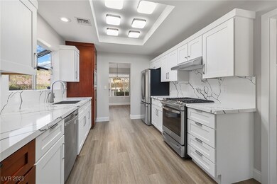 Kitchen with stainless steel appliances, a sink, u