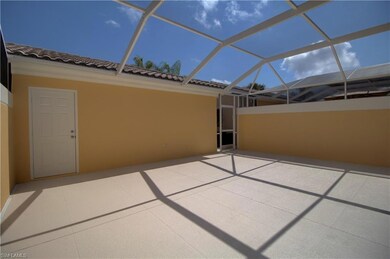 screened lanai with privacy walls leading to two c