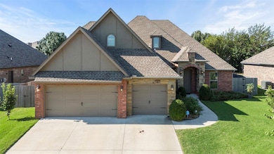 View of front of property with a shingled roof, driveway, brick siding, an attached garage, and stucco siding