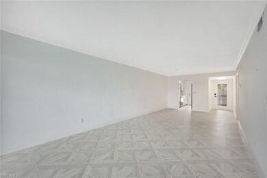 Unfurnished room with baseboards and ornamental molding