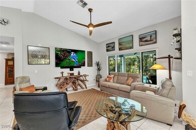 Living area with light tile patterned floors, visi