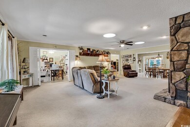 Spacious living room with fireplace and separate o