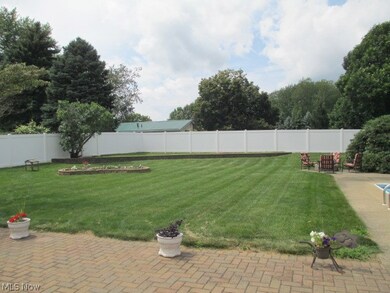 Huge back yard with solid vinyl fence.