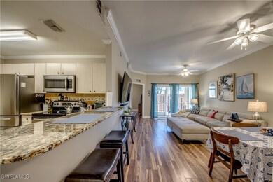 Kitchen with visible vents, crown molding, wood fi