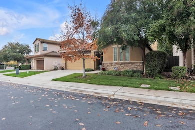 The exterior showcases beautiful brick accents. Front landscaping is maintained by the HOA for a consistently manicured look.
