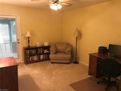 Spacious guest bedroom with access to full bath and back screened porch.