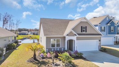 Craftsman-style house with concrete driveway, boar