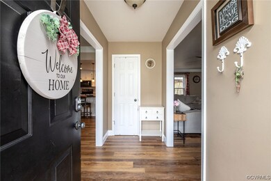 Entrance foyer featuring dark hardwood / wood-styl