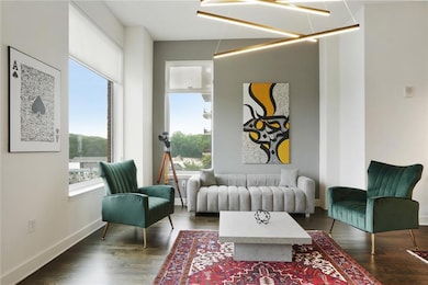Living area featuring wood finished floors and baseboards